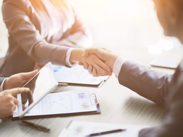 Business people shaking hands, finishing up a meeting